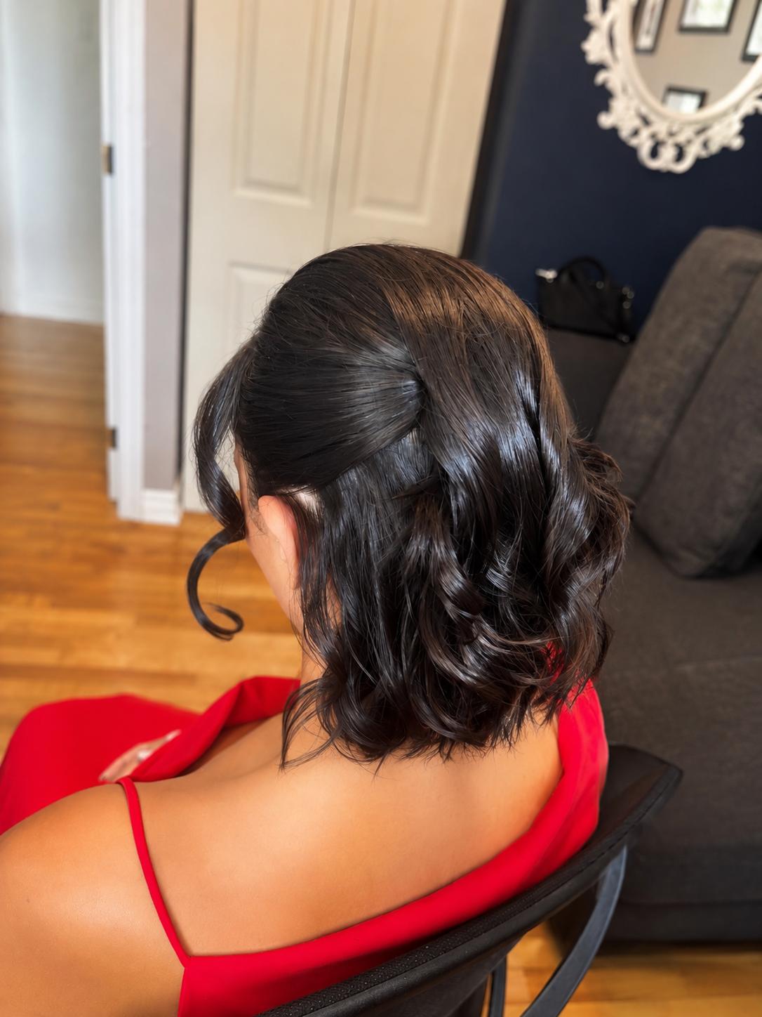 Curled bob updo styled for a night out