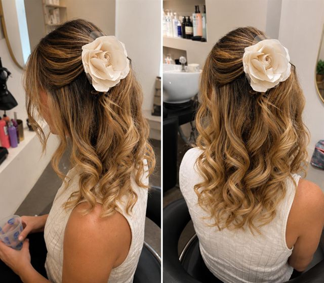 Half-up waves on honey balayage with an ivory flower clip, two views