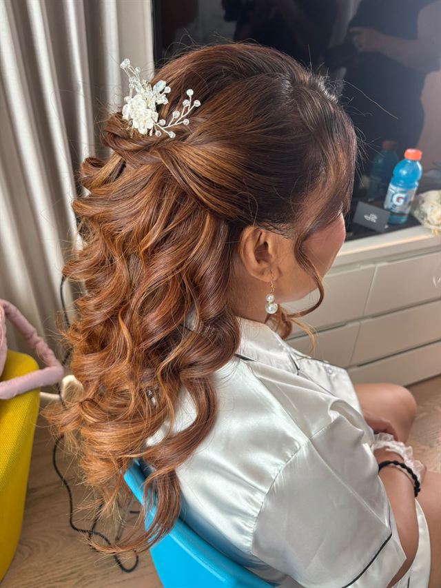Copper curls, half-up with a crystal floral pin